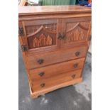 Oak tall boy with two cupboard doors above three drawers (81cm x 49cm x 106cm)