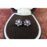 Pair of diamond and sapphire flower head earrings