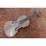 An unusual violin with internal paper label for Schuster & Co 1910, with carved lion head