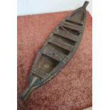 19th/20th C carved wood model of a canoe (overall length 67cm)