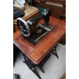 Vintage Singer sewing machine and table with wrought metal base