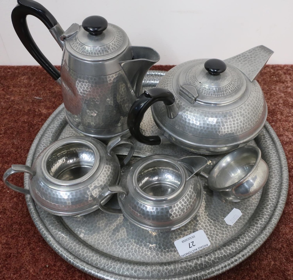 Five piece Sheffield pewter tea service with hammered detail on circular tray, with a pewter ladle