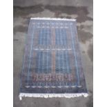 Traditional Middle Eastern patterned rug, blue grey ground with geometric border (124cm x 200cm)