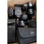 Box of various photographic equipment including a Minolta Dynax 700 SI camera with a 28-80 lens