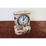 Ceramic cased mantel clock with white enamel dial, the case decorated with birds and foliage, the