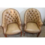 Pair of early - mid 20th C tan leather deep button back armchairs on tapering supports
