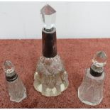 Cut glass dressing table scent bottle with white metal collar and two other smaller scent bottles