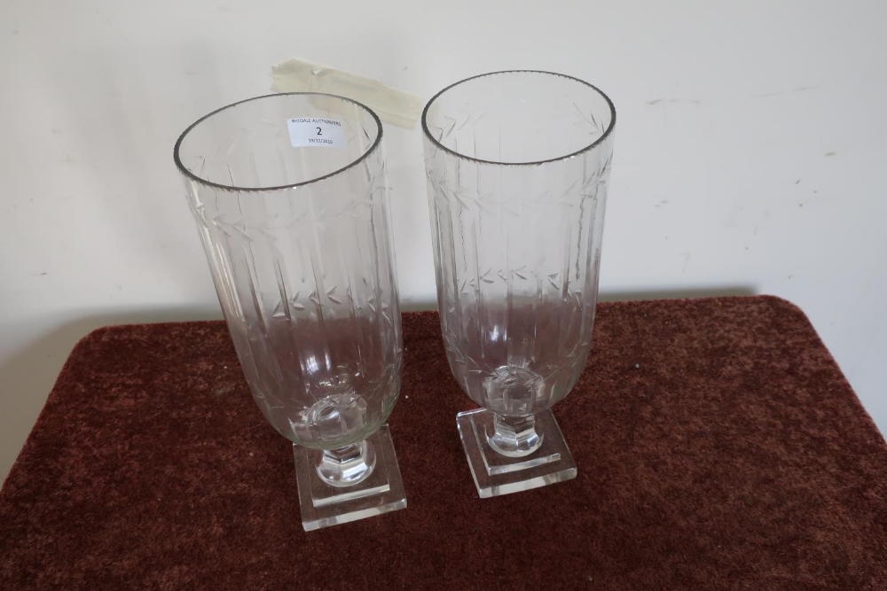 Pair of glass vases with etched and fluted design and stepped square bases (34cm high)
