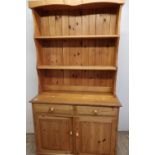 Modern pine dresser with two tier raised back above two drawers and two cupboard doors (width 110cm)