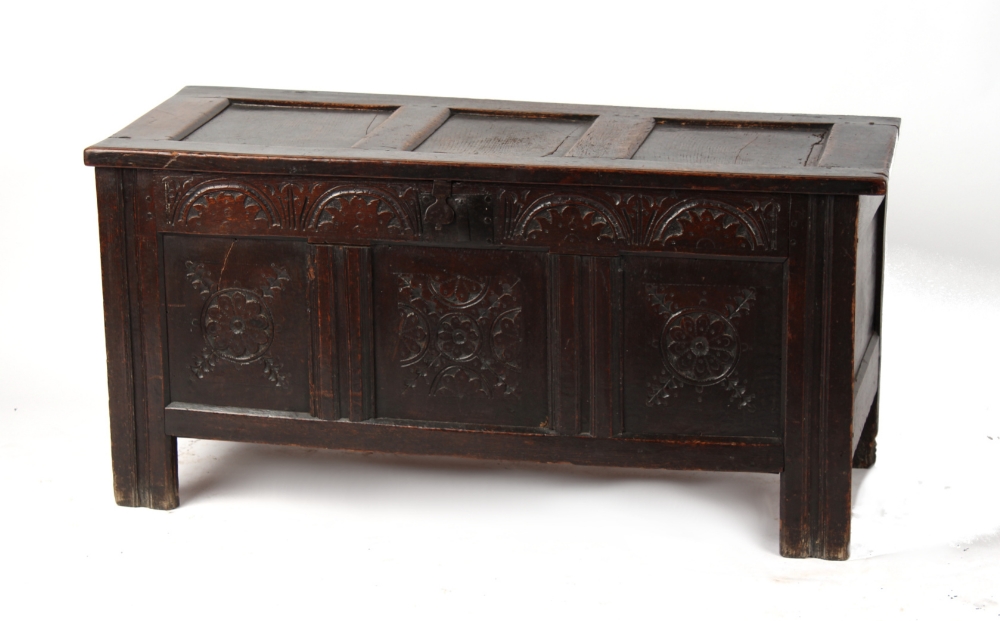 Property of a gentleman - a late 17th century carved oak coffer with three panel top, 48.4ins. (