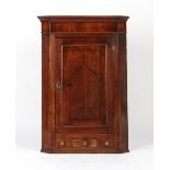 Property of a deceased estate - a George III oak & mahogany single door corner wall cabinet,