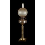 Property of a deceased estate - a brass paraffin oil lamp, with faceted clear glass reservoir,