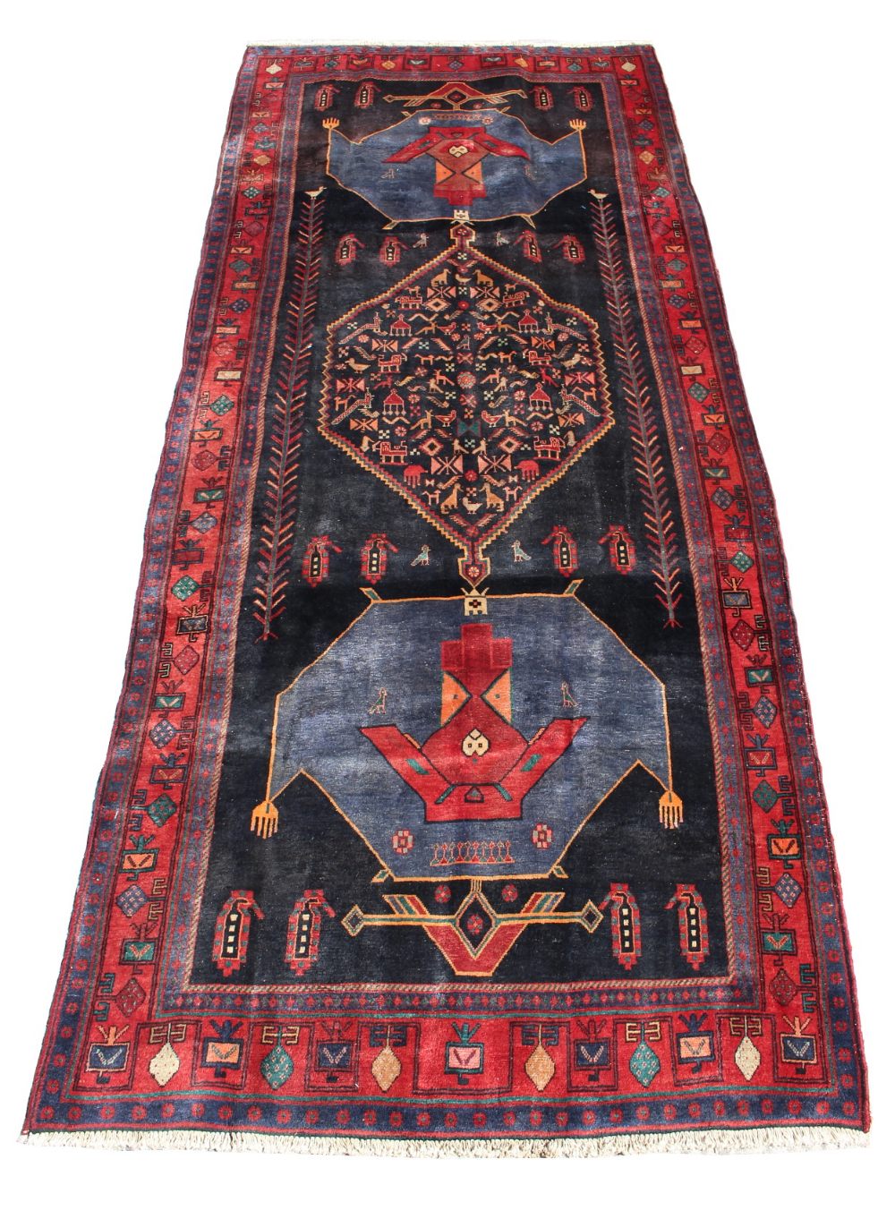 A Kordi woollen hand-made runner with navy ground, 140 by 59ins. (355 by 150cms.) (see