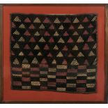 Property of a deceased estate - a Baluchi weaving, in glazed frame, 29 by 31ins. (74 by 79cms.) (