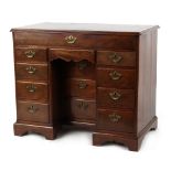 Property of a deceased estate - an 18th century George III mahogany kneehole desk with an