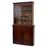 Property of a lady - a mahogany two-part bookcase, the early 19th century George IV top with tracery