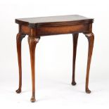 Property of a gentleman - a reproduction swivel-top foldover card table with shell carved cabriole