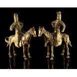 Property of a lady - a pair of Chinese polished bronze models of warriors on horseback, each inset