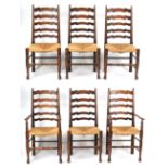 Property of a gentleman - a set of six oak & rush seated ladder-back dining chairs including two