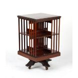 Property of a deceased estate - an Edwardian mahogany revolving bookcase, 33ins. (84cms.) high (