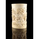 A good late 19th century carved ivory tusk section, probably Dieppe, carved in high relief with nine