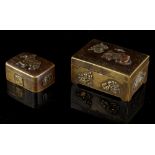Two small Japanese mixed metal boxes, the larger 2.3ins. (5.8cms.) wide (2) (see illustration).