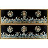 A pair of Chinese embroidered silk panels depicting floral roundels above waves, late 19th / early