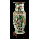 A late 19th century Chinese famille verte hexagonal baluster vase, painted with warriors in