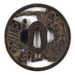 Property of a gentleman - a Japanese gold inlaid iron tsuba, 19th century or earlier, decorated with