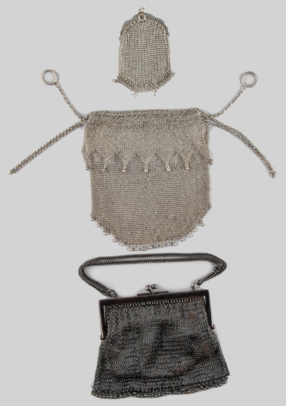 A private collection of handbags from a deceased estate - a white metal mesh purse with drawstring