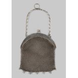 A private collection of handbags from a deceased estate - an Edwardian silver mesh evening bag,