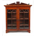 Property of a deceased estate - an oak glazed two-door bookcase, the adjustable shelves with leather