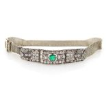 An early 20th century Art Deco emerald & diamond three panel bracelet, the centre rectangular