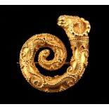 A yellow gold (tests 18ct) brooch in the manner of Lalounis, of coiled form with ram's head