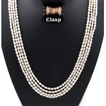 Property of a lady - a freshwater pearl four strand necklace, the yellow gold clasp of waisted