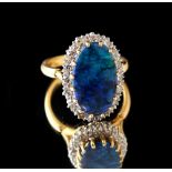 An 18ct yellow gold black opal & diamond ring, the oval black opal measuring approximately 16.8 by