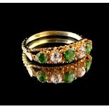 An unmarked yellow gold demantoid garnet & diamond five stone ring, the three round cut demantoid