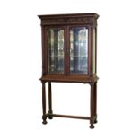 Property of a gentleman - a late 19th century French carved walnut china display cabinet on stand,