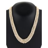 A fine natural saltwater pearl three strand necklace, the 318 graduated pearls ranging from