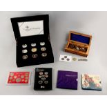 Property of a deceased estate - a cased set of nine commemorative ï¿½5 coins; together with an