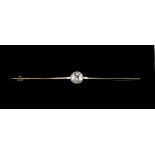 Property of a gentleman - a diamond solitaire bar brooch, the millegrain set round brilliant cut