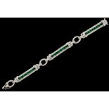 An attractive Art Deco style 18ct white gold emerald & diamond link bracelet, set with twenty-four