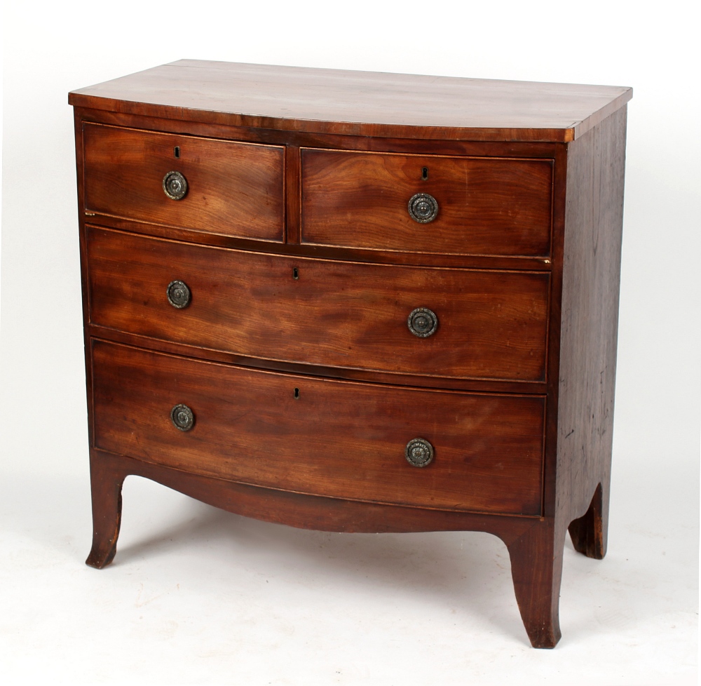 Property of a lady - a small early 19th century mahogany bow-fronted chest of two short & two long