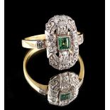 An Art Deco unmarked yellow gold emerald & diamond ring, the central square cut emerald in pierced