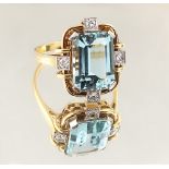 An Art Deco style 14ct yellow gold aquamarine & diamond ring, the emerald cut aquamarine weighing