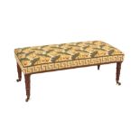 Property of a lady - a George IV style rectangular stool, with acorn patterned needlework
