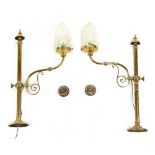 Property of a gentleman - a pair of early 20th century brass wall lights with clear glass shades,
