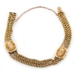 Property of a lady - a Victorian unmarked yellow gold triple chain bracelet with foliate chased