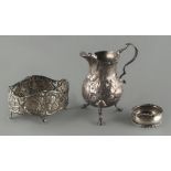 Property of a gentleman - an early George III silver baluster cream jug, with floral repousse