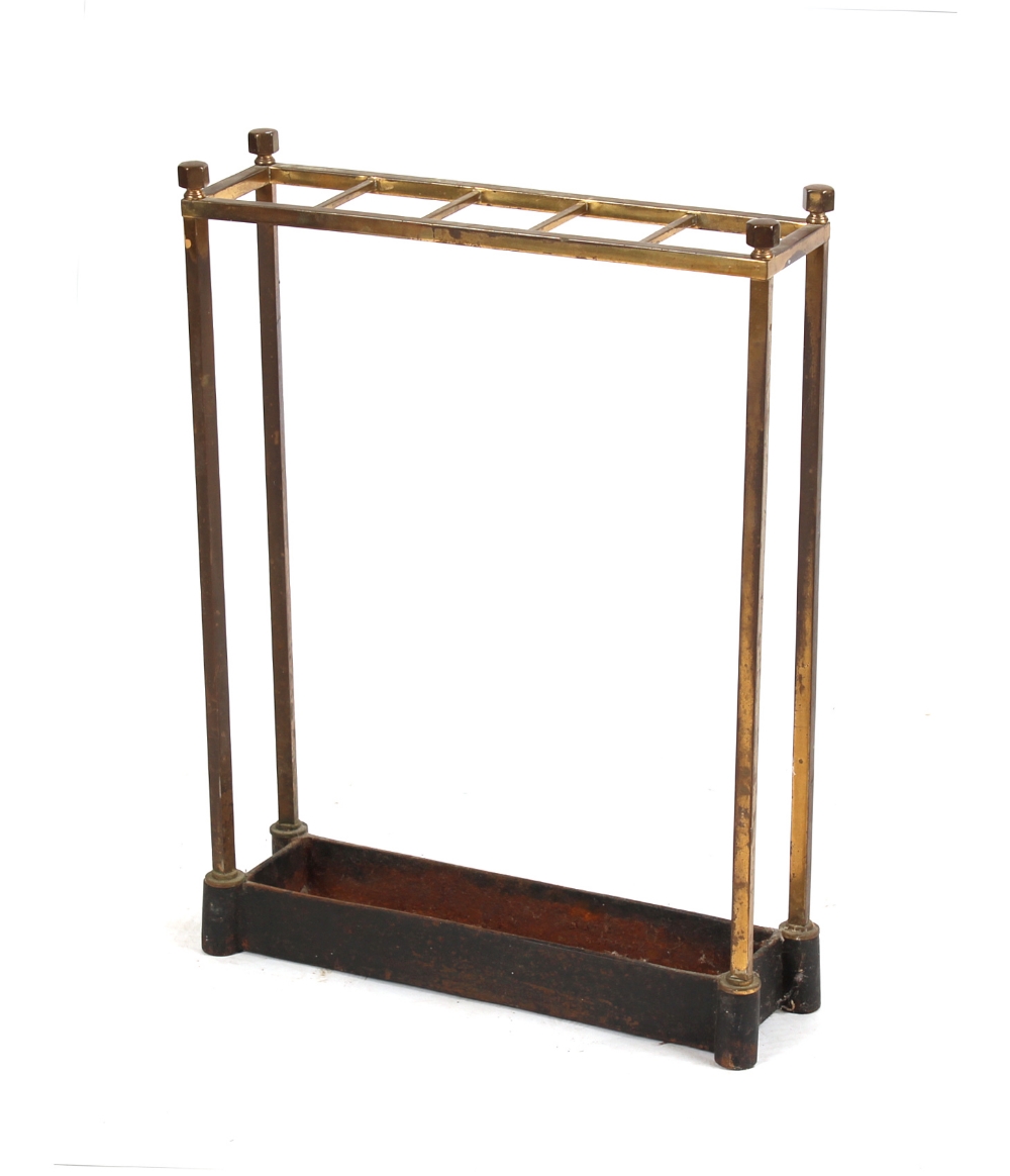 Property of a deceased estate - an Edwardian brass five division stickstand, with cast iron base (